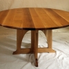 round table: An original creation, this piece is inspired by the works of a number of Arts and Crafts masters, and in particular by the creative use of intersecting rectilinear planes by Charles P. Limbert (1854-1923), producing a highly attractive table with a tidy, uncluttered form.
