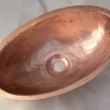 Very small hammered copper sink for a client's private jet.